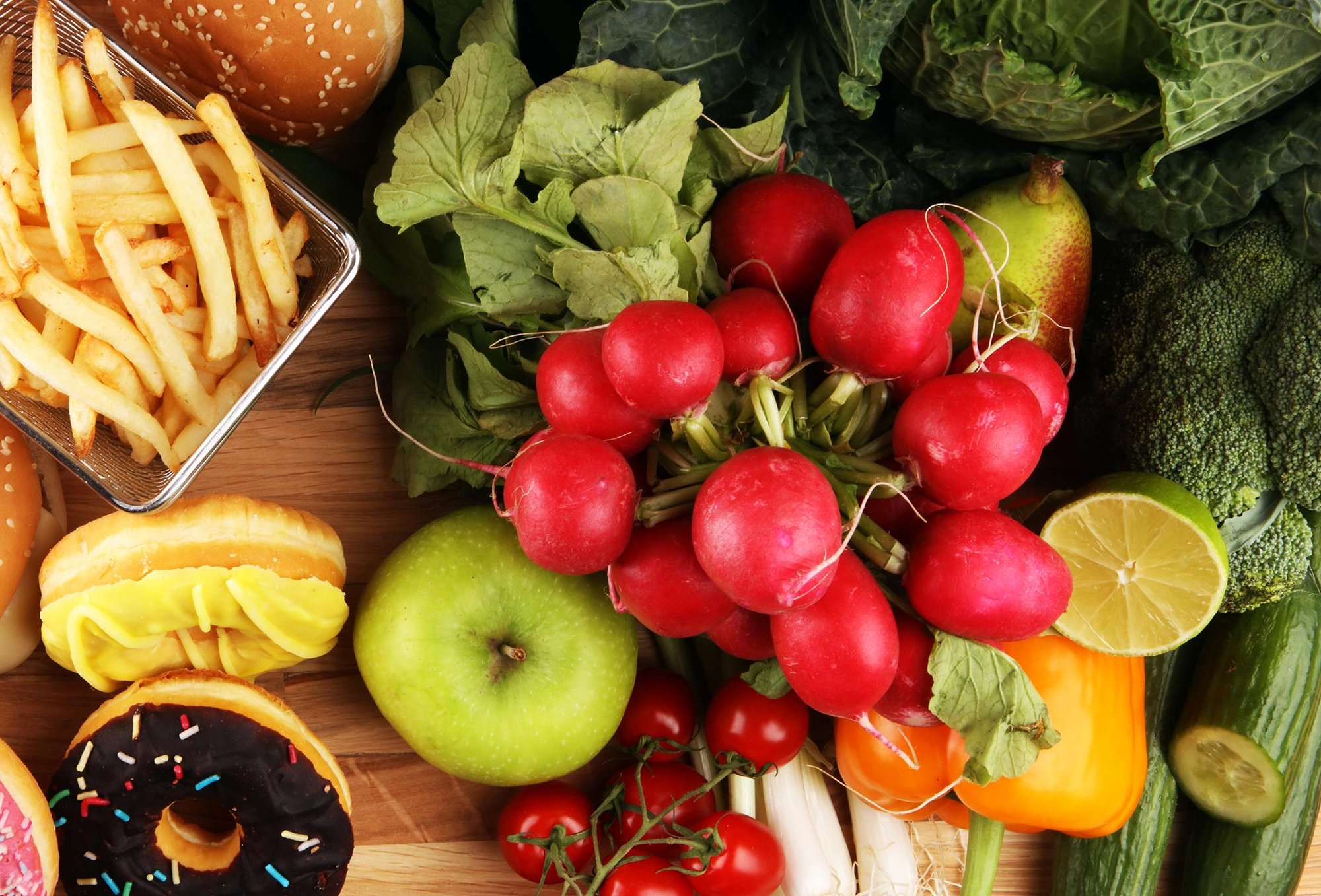 Split view of colorful vegetables and indulgent foods representing the 80/20 Method — a balanced nutrition approach.