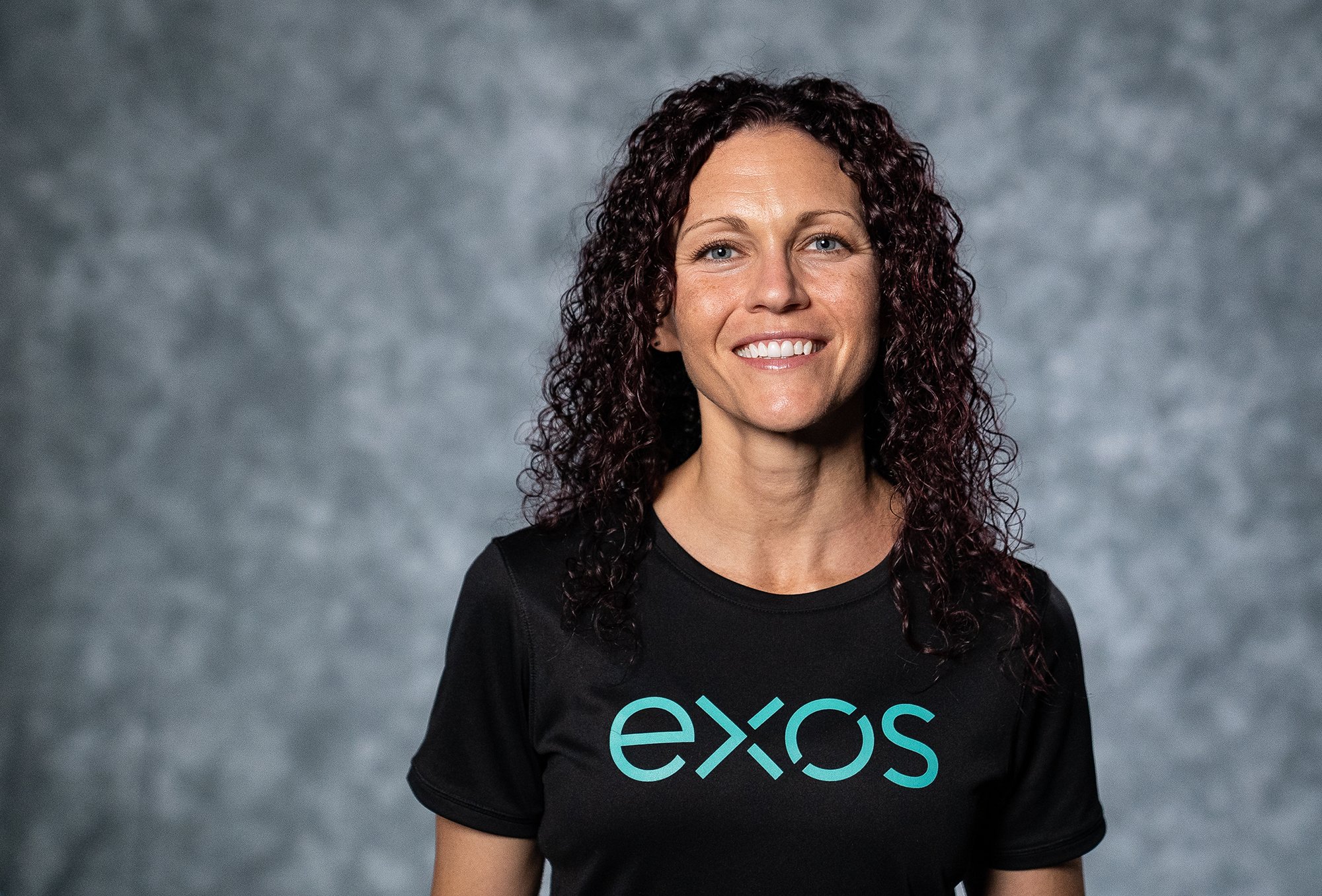 Headshot of Coach Michelle Rogerson, Exos' Sr. Performance Manager and a high-performance coach who serves executives.