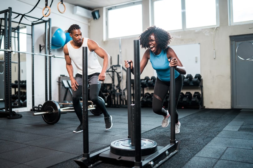 Employee training with coach—building strength and resilience to show how well-being fuels workplace performance.